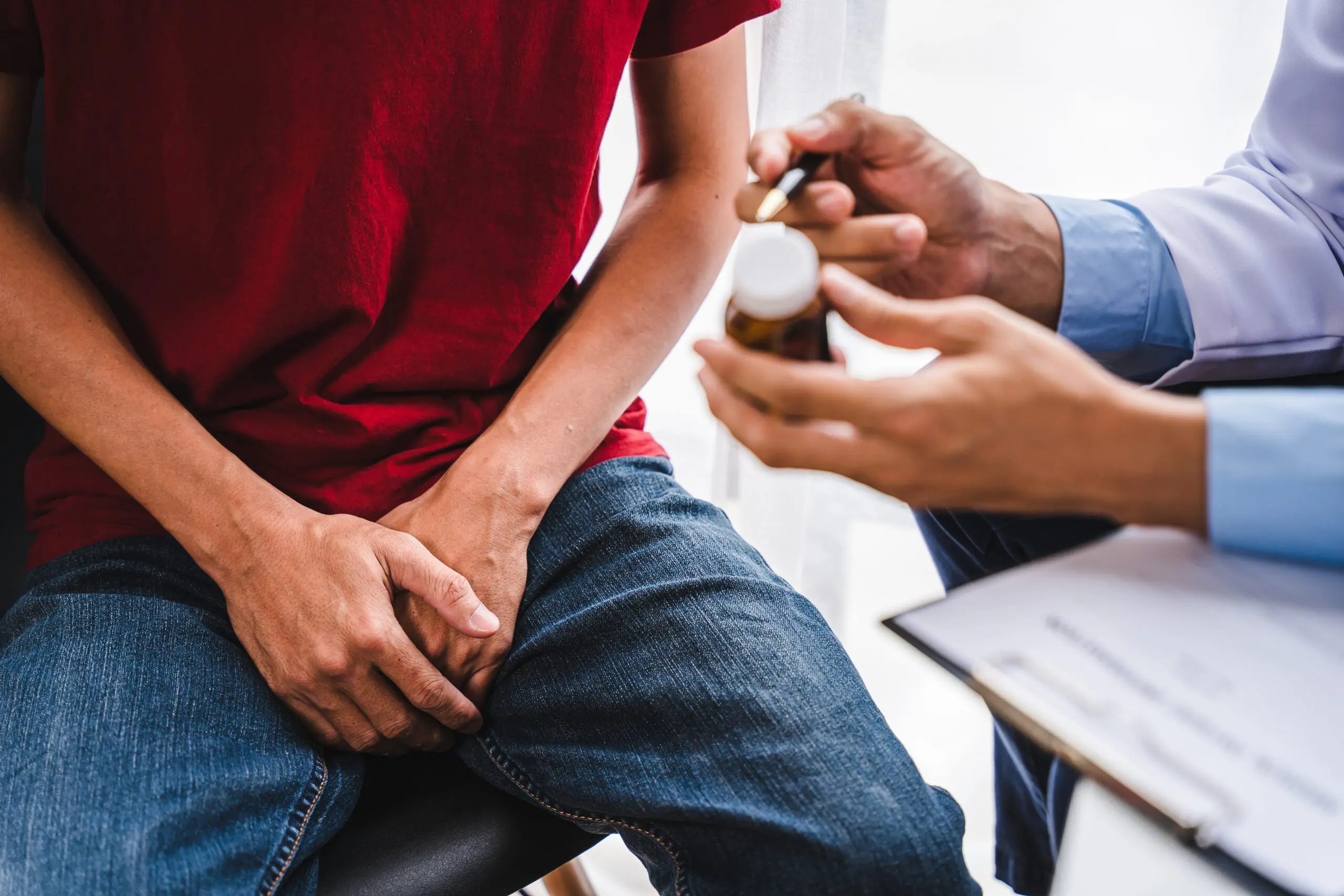 man talking to a doctor about medication