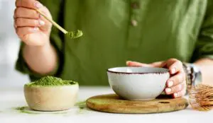 person making green tea