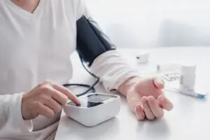 person checking their blood pressure