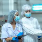 inspectors at a drug manufacturing plant