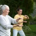 older women practicing tai chi