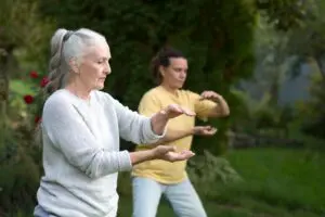 older women practicing tai chi