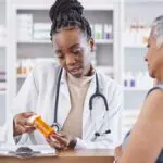 woman talking to pharmacist