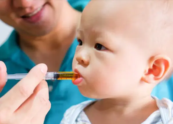 Baby taking medicine