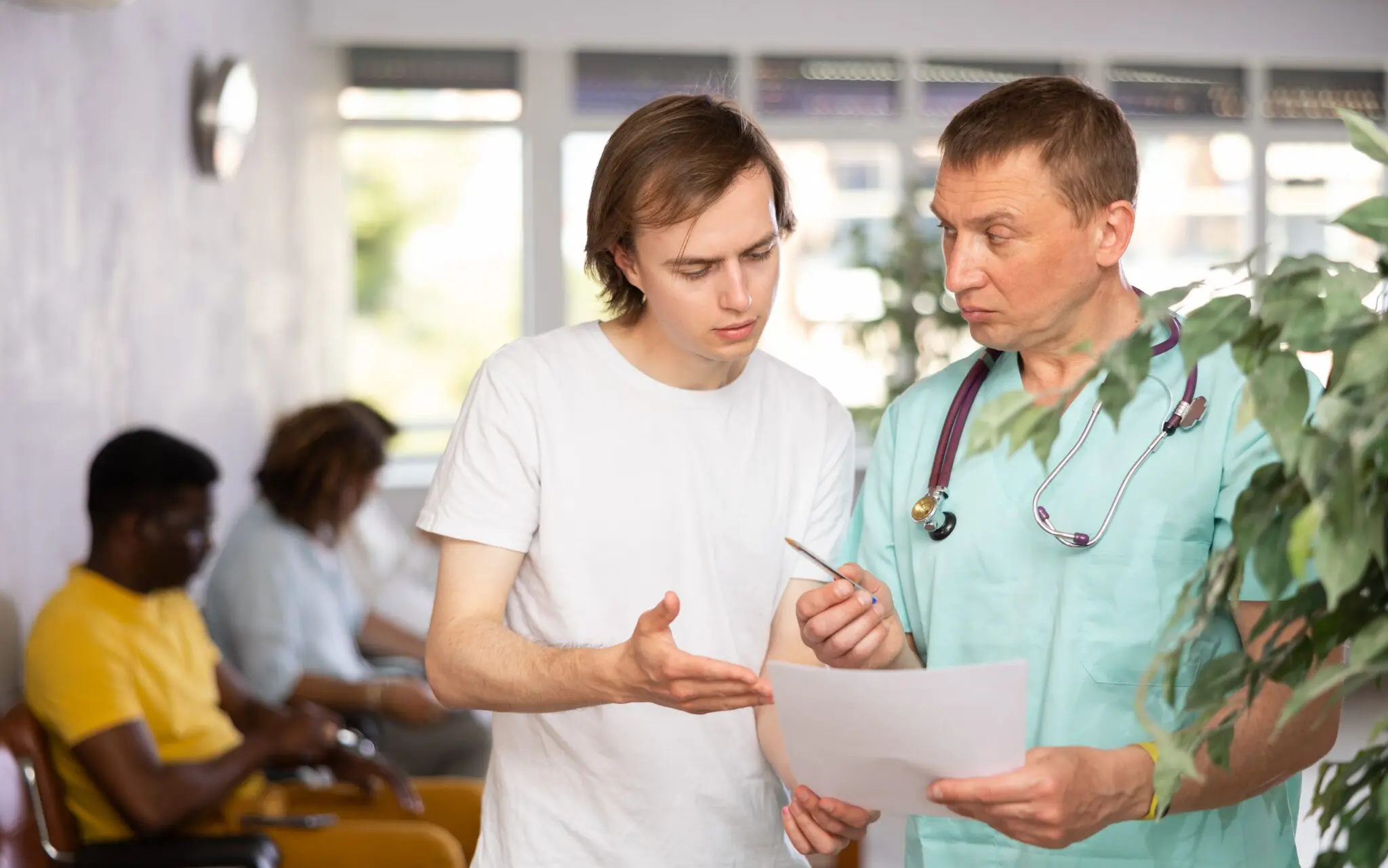 young man talking to doctor about a drug holiday