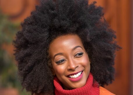 happy woman with afro