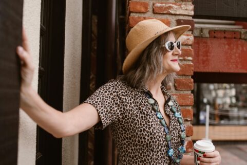 older woman smiling, using HRT