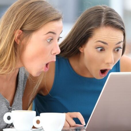 two women reading news