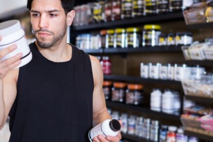 man choosing a supplement, considering ashwagandha for anxiety