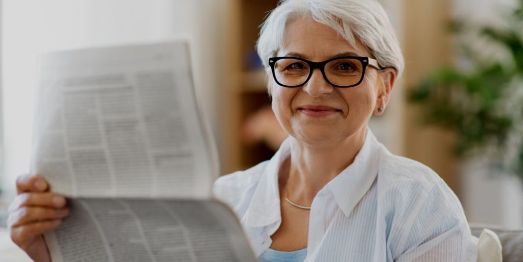 Woman reading newspaper