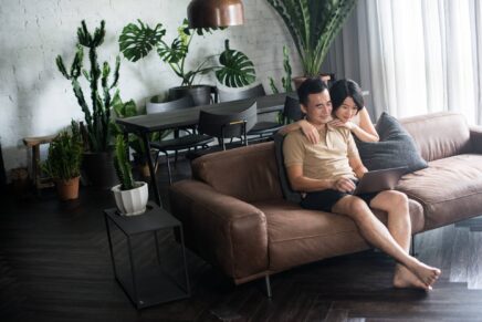 couple with indoor plants that combat harmful pollutants and allergens