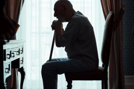deprescribing, man silhouette sitting with cane