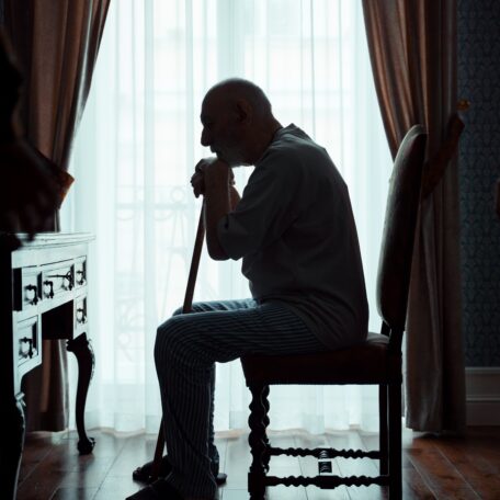 deprescribing, man silhouette sitting with cane