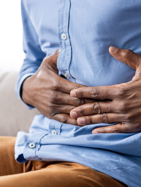 Common GI Issues And The Medications That Treat Them, man holding stomach