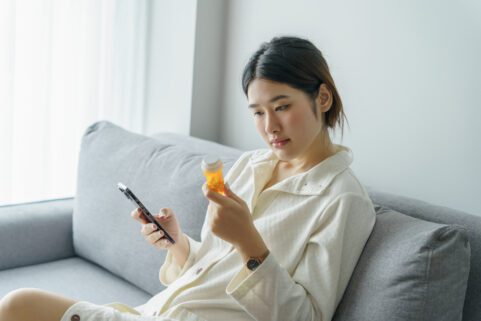 can I take lexapro with st john's wort, woman looking at pill bottled