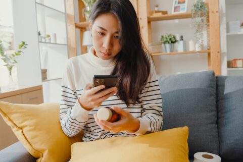 Can I Take Zyrtec with Xanax? woman looking at pill bottle