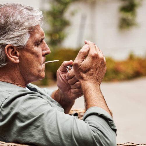 Reckoning With The Complicated Side Effects Of Cannabis, older man smoking cannabis