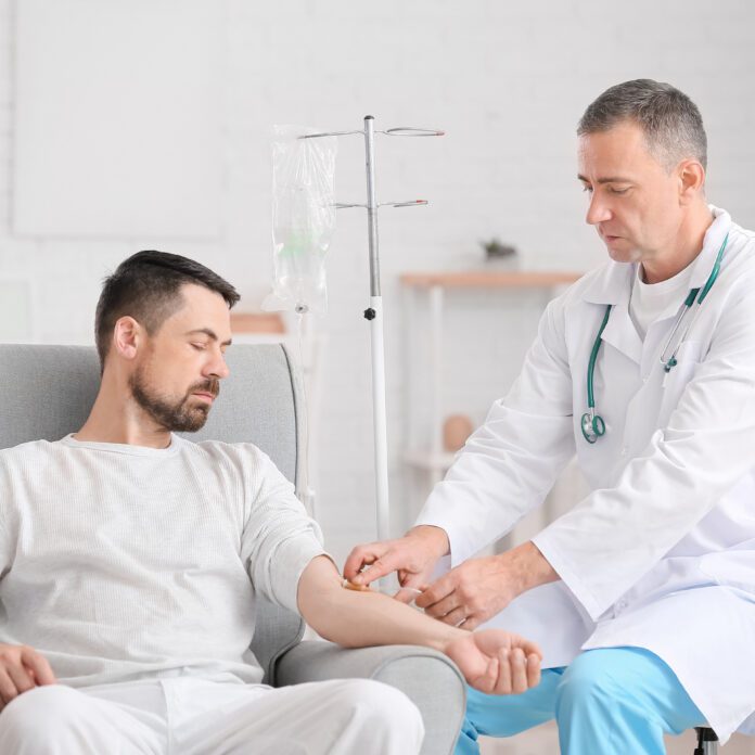 Remicade and the Onset of New Autoimmune Diseases, man getting intravenous solution