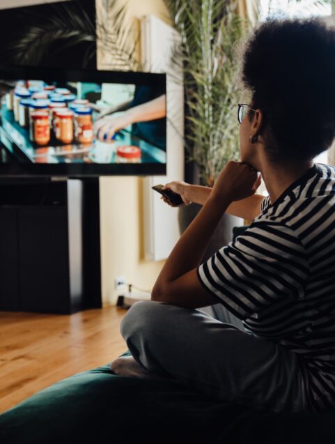 Woman watching a DTC commercial