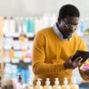 Older man looking at medicine in drug store, PPIs and dementia link
