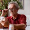 Can I Take Advil with Eliquis? Older man taking pills