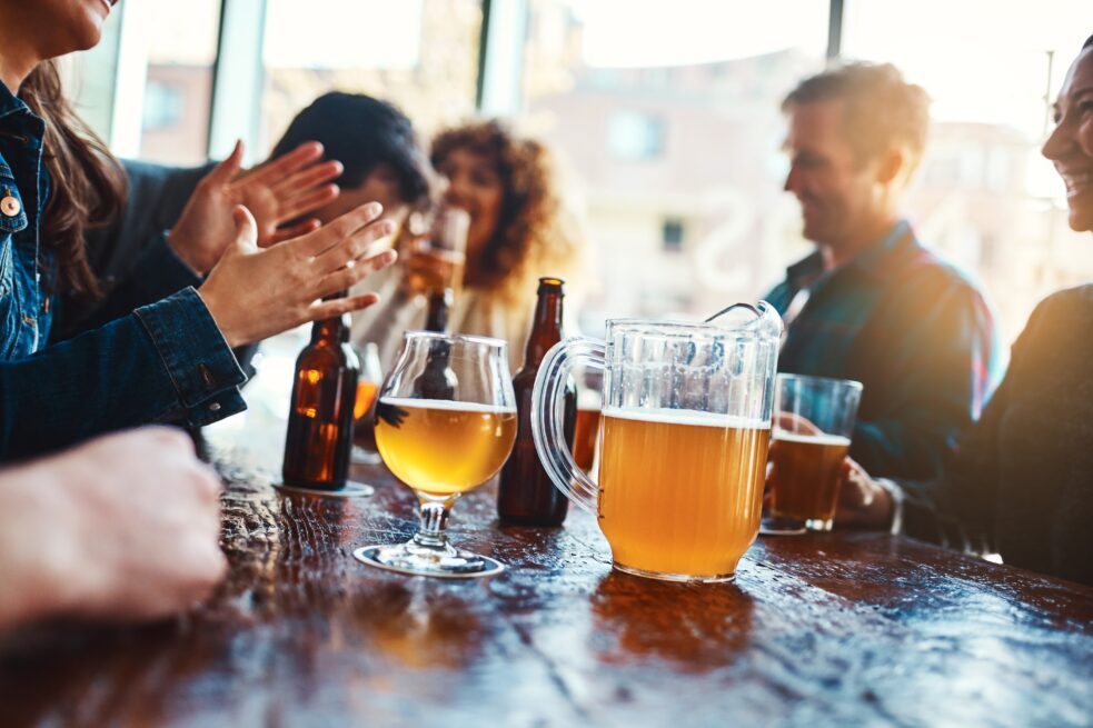 friends drinking at brewery,