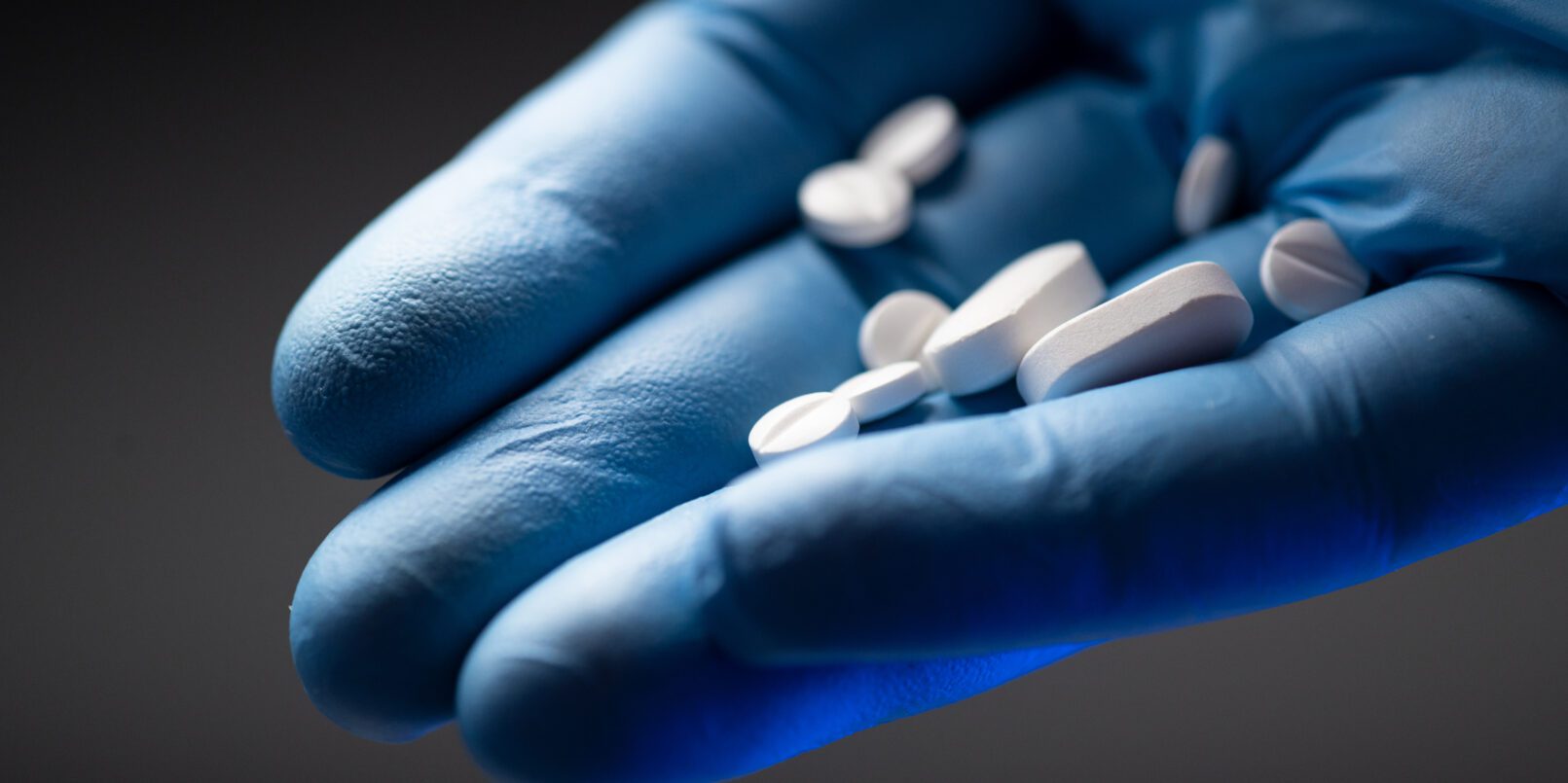 Two-Thirds of Americans Would Pay More for Safer Drugs. hand holding medication