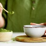 person making green tea