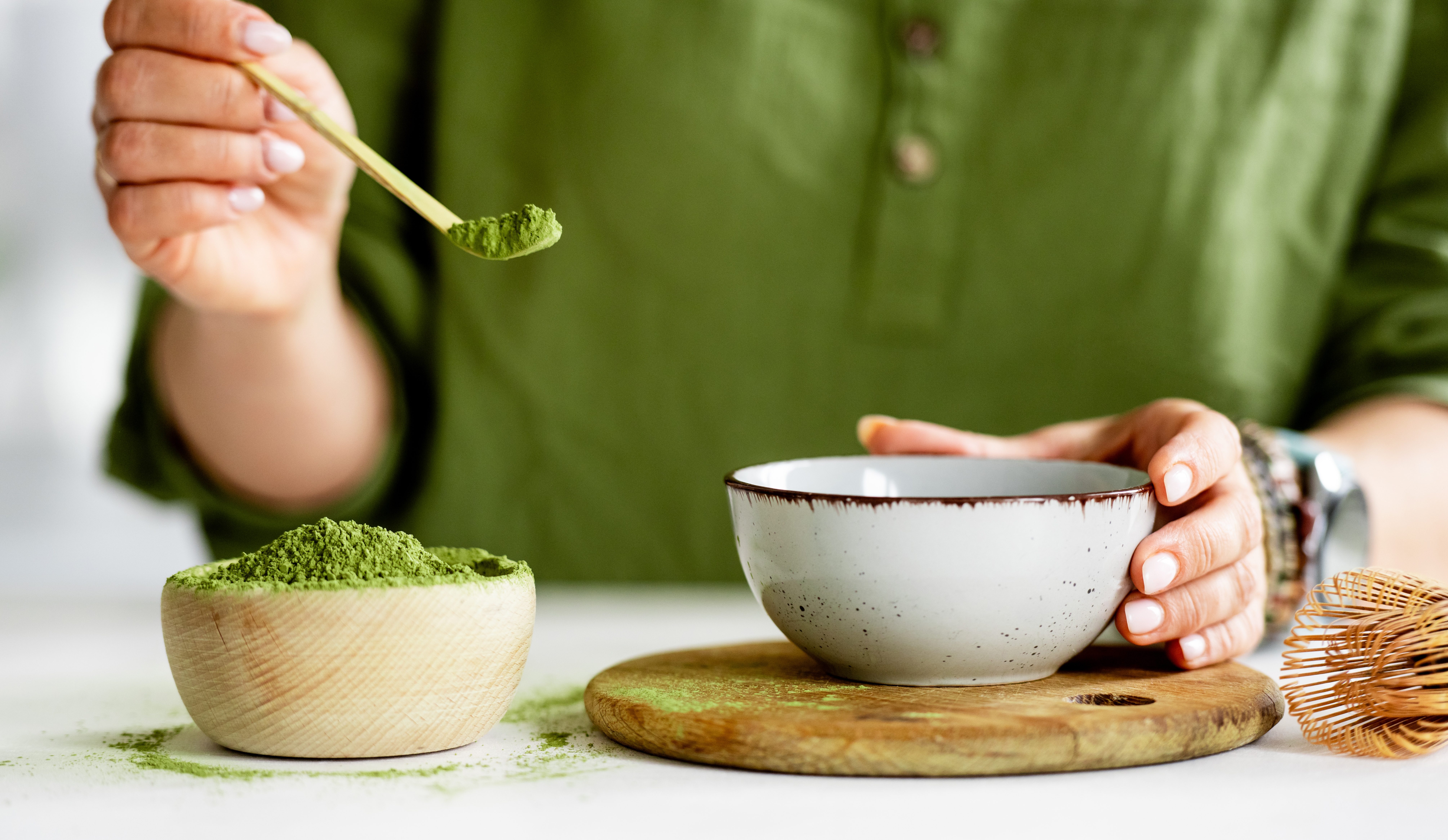 person making green tea