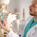 doctor pointing to skeleton