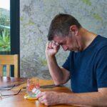 man in pain taking pain med