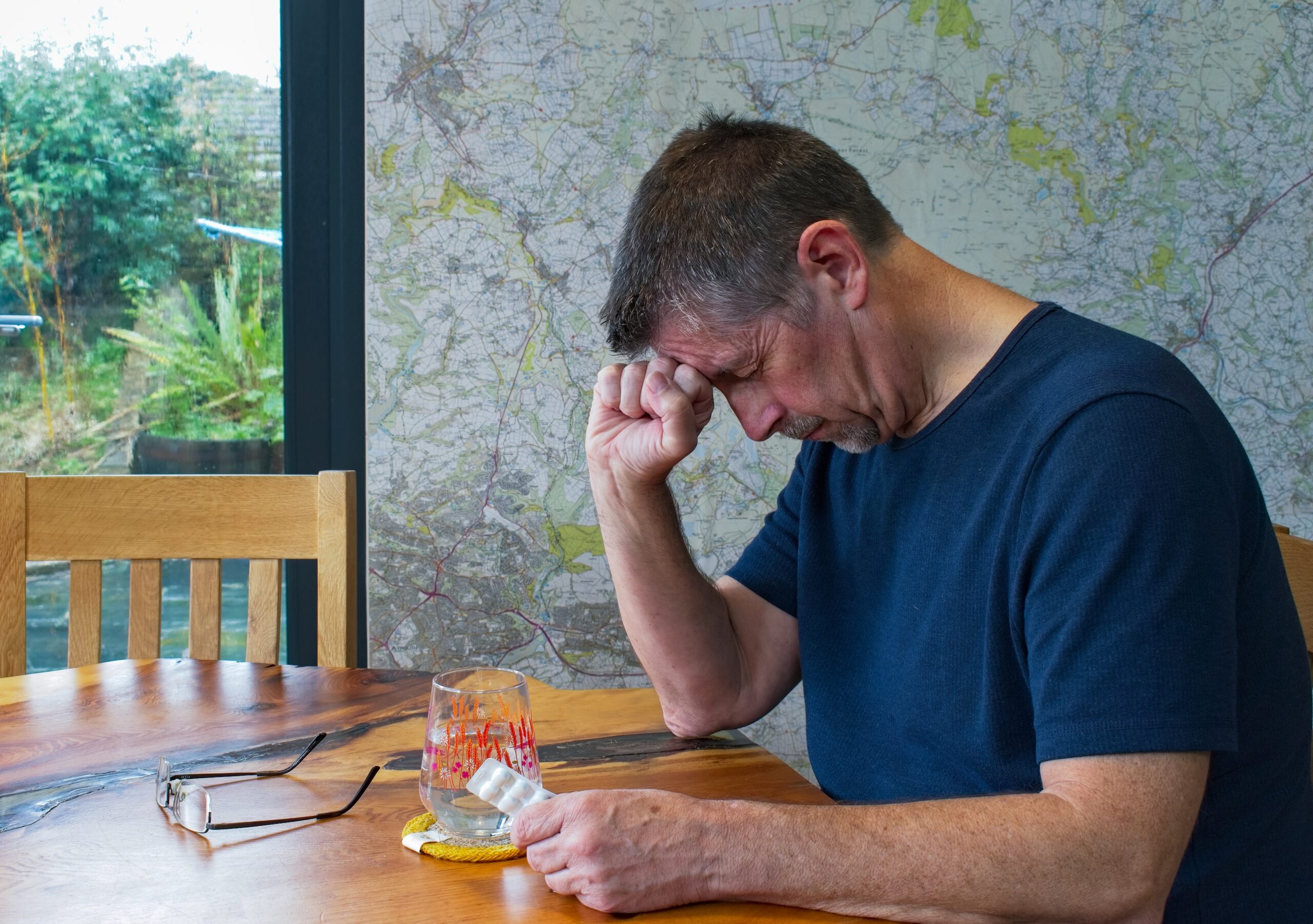 man in pain taking pain med