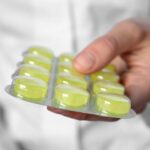 person holding cough drops