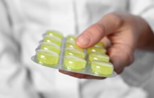 person holding cough drops