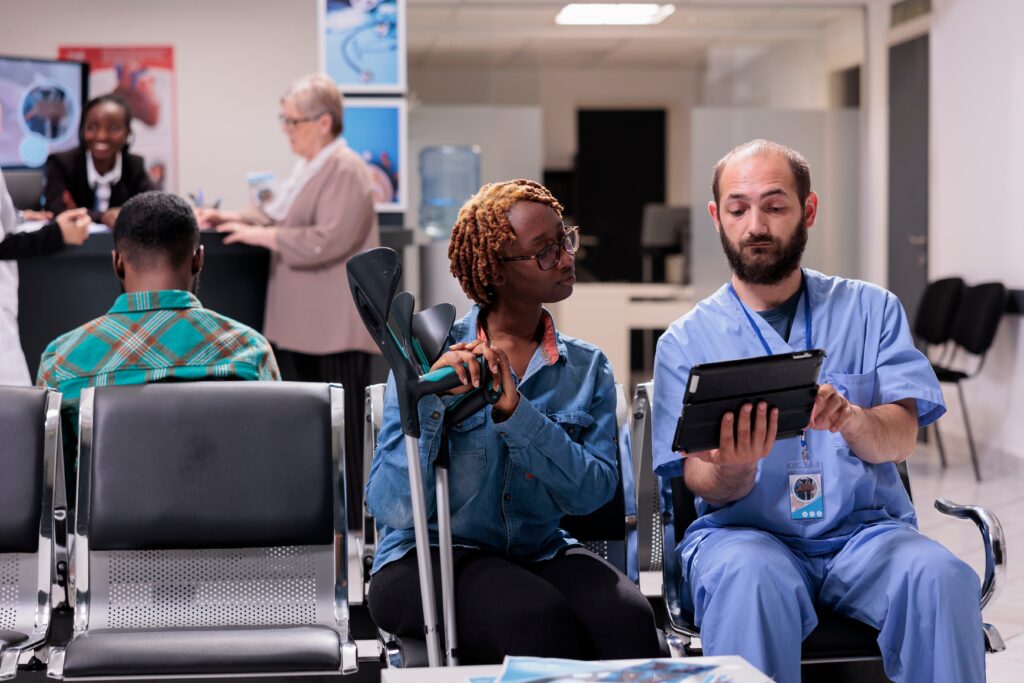 nurse talking to patient with cane