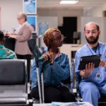nurse talking to patient with cane