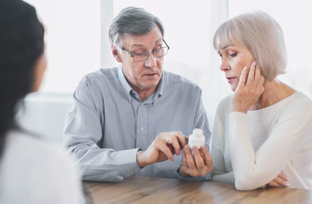 older adults looking at medications