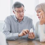 older adults looking at medications
