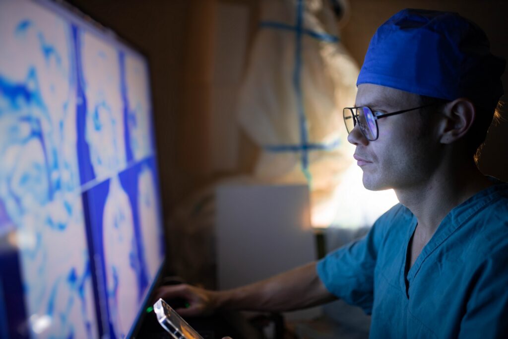 radiologist looking at images of brain