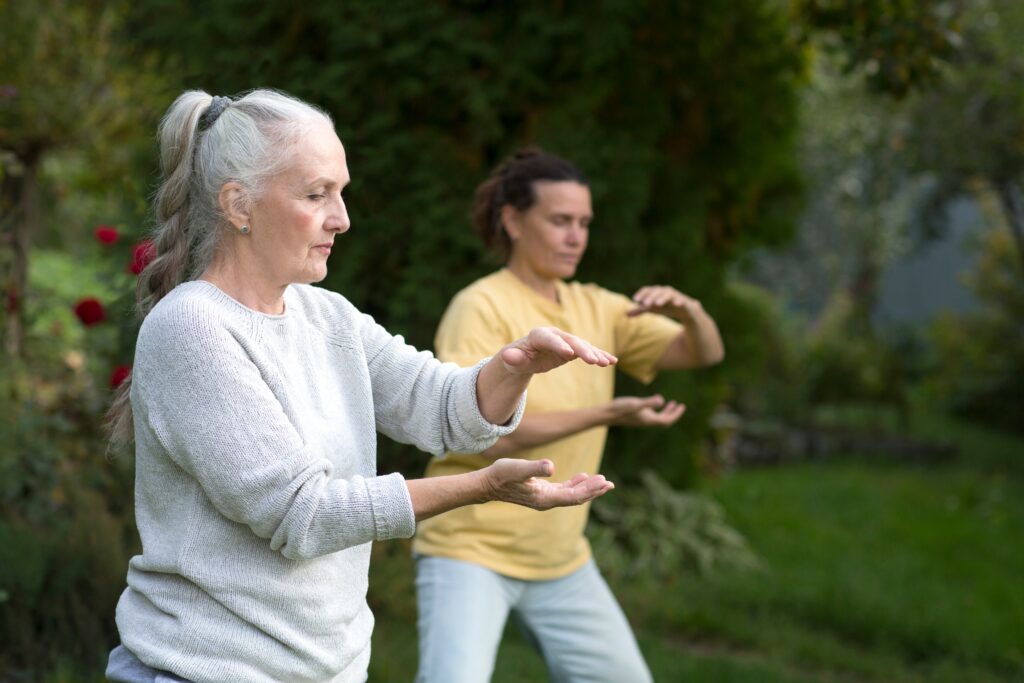 older women practicing tai chi