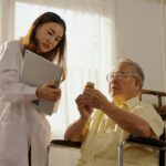 older man talking to nurse