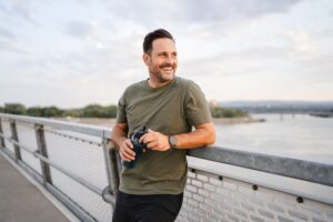 man sitting by river