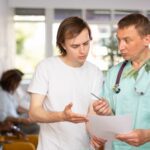 young man talking to doctor about a drug holiday