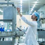 man doing quality control at a drug manufacturing lab
